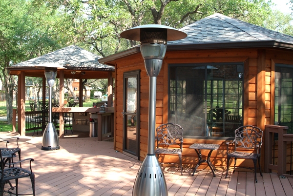 Durable composite decking combine with the warmth of cedar in this upscale outdoor living area