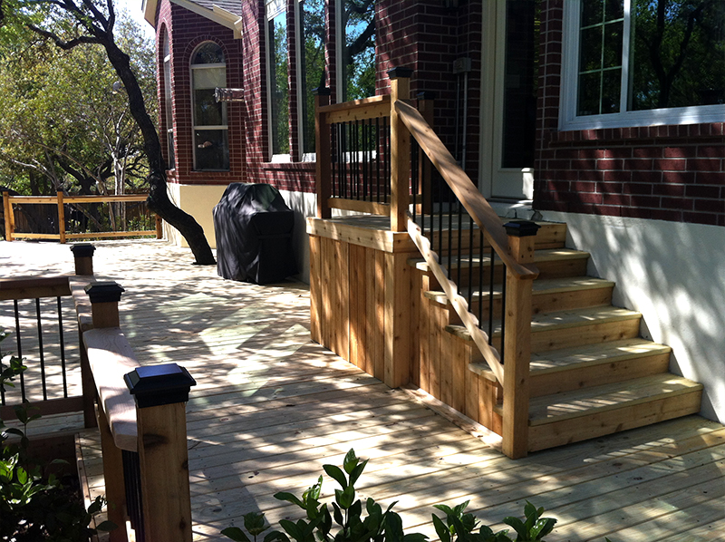 Raised Landing Leads Down Staircase to Treated Pine Deck